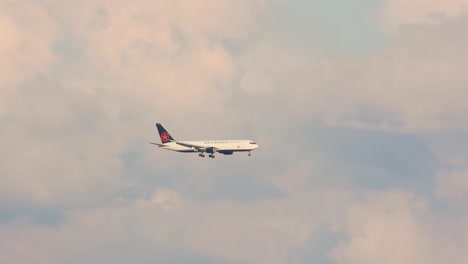 Air-Canada-Boeing-Plane-In-Flight-Against-Cloudy-Sunset-Sky