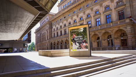 Informative-advertisement-of-the-National-Theater-in-prague-with-lonely-calels-on-a-sunny-day,-cultural-monument-of-the-Czech-Republic-Národní-divadlo