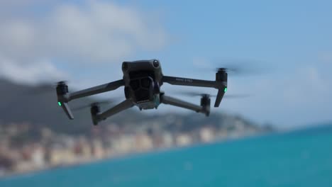 Flying-DJI-Mavic-3-Pro-modern-quadcopter-drone-in-static-flight-position