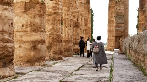 Woman-walking-inside-a-Greek-temple-in-Paestum