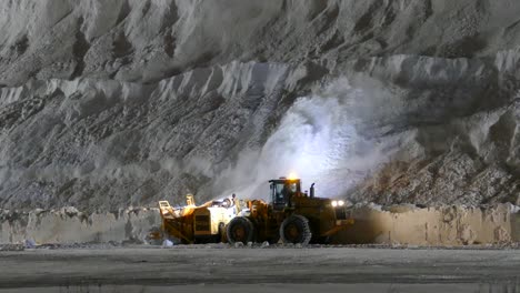Tractor-Blowing-Snow-Onto-Massive-Pile-At-Snow-Dump