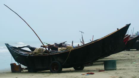 Traditional-Wooden-Fishing-Trawler-Boats-At-Seashore-Of-Indian-Ocean-During-Monsoon-Season