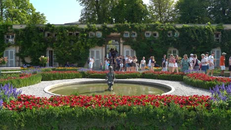 Huge-Group-of-Tourists-Walks-Through-Mirabell-Palace-Gardens