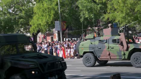 Spanish-soldiers-on-armored-vehicles,-such-as-tanks,-participate-in-the-Spanish-National-Day-military-parade-as-thousands-of-soldiers-and-civilians-gather-to-celebrate-the-annual-anniversary