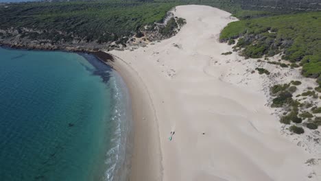 drone-flies-towards-the-famous-dune-of-bolonia-north-of-tarifa-in-spain,-sunny-weather