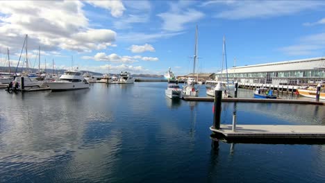 Pan-around-the-wharf-area-at-Hobart-showing-boats-and-small-historic-wooden-ship