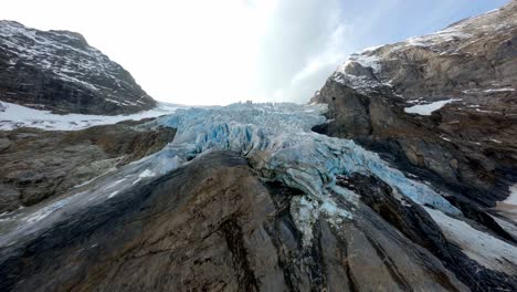Flight-across-glacier-in-the-mountains