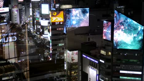 A-view-from-above-of-building-top-LED-advertising-displays-at-night-in-the-iconic-Shibuya-at-night