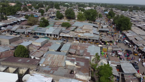 Rural-village-Market-in-Maiduguri,-Nigeria,-West-Africa---aerial-reveal