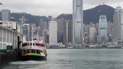 Shot-of-boat-resting-in-In-Tsim-Sha-Tsui-waters,-Hong-Kong,-China