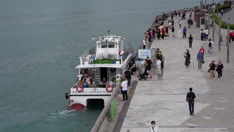 Aerial-view-of-Hong-Kong-Water-Taxi-and-tourists-at-harbour