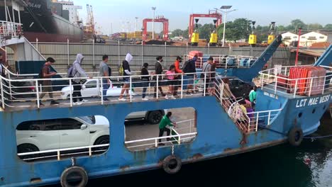 People-are-embarking-down-from-a-cargo-ship