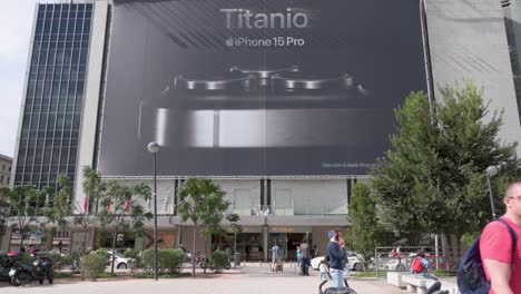 A-large-commercial-billboard-advertisement-hangs-at-a-shopping-mall-announcing-the-Apple-iPhone-15-Pro-titanium-for-sale