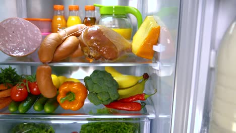 Open-refrigerator-filled-with-food