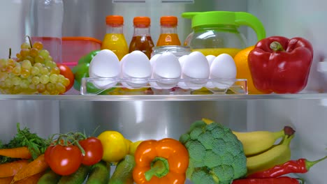 Open-refrigerator-filled-with-food