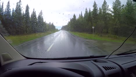 View-from-the-car-in-the-rain-driving-on-wet-roads.-Driving-a-Car-on-a-Road-in-Norway