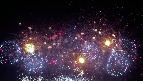 Colorful-fireworks-exploding-in-the-night-sky.-Celebrations-and-events-in-bright-colors.