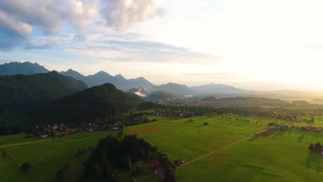 Panorama-from-the-air-sunset-Forggensee-and-Schwangau,-Germany,-Bavaria