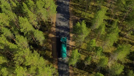 Aerial-View-of-the-Forest-in-Finland.-Car-moving-on-the-road,-top-view.-Beautiful-nature-of-Finland.