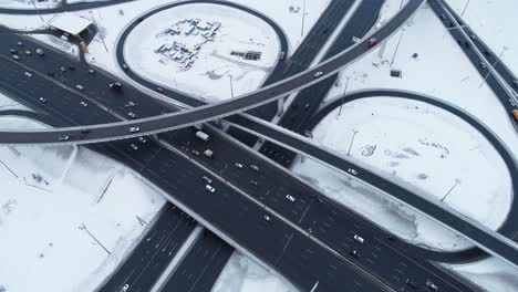 Aerial-view-of-a-freeway-intersection-Snow-covered-in-winter.