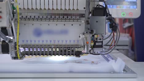 Automatic-industrial-sewing-machine-for-stitch-by-digital-pattern.-Modern-textile-industry.