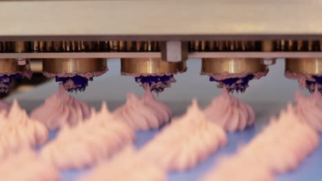 Cakes-on-automatic-conveyor-belt-,-process-of-baking-in-confectionery-factory.