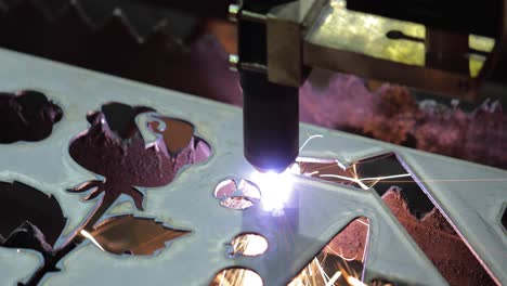 CNC-plasma-cutting-of-metal,-modern-industrial-technology.-Plasma-cutting-is-a-process-that-cuts-through-electrically-conductive-materials-by-means-of-an-accelerated-jet-of-hot-plasma.