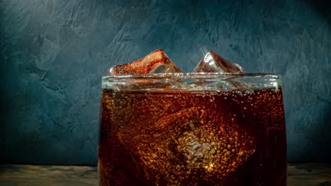 Cola-with-Ice-and-bubbles-in-glass.