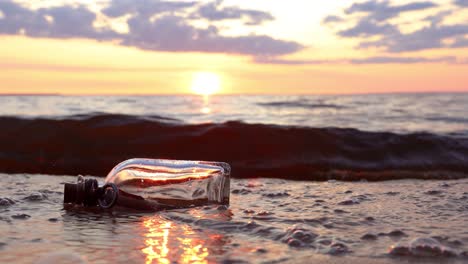 Message-in-the-bottle-against-the-Sun-setting-down