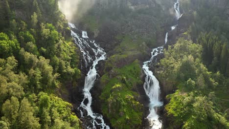 Latefossen-is-one-of-the-most-visited-waterfalls-in-Norway-and-is-located-near-Skare-and-Odda-in-the-region-Hordaland,-Norway.-Consists-of-two-separate-streams-flowing-down-from-the-lake-Lotevatnet.