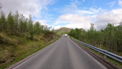Vehicle-point-of-view-Driving-a-Car-VR-Caravan-travels-on-the-highway.-Tourism-vacation-and-traveling.-Beautiful-Nature-Norway-natural-landscape.