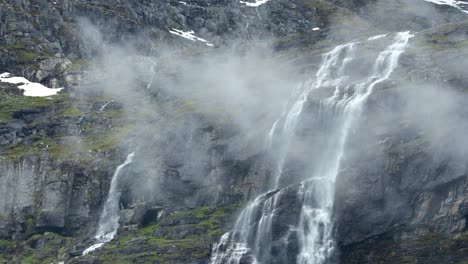 Beautiful-nature-of-Norway.-A-mountain-waterfall-from-a-glacier-high-in-the-mountains-of-Norway.