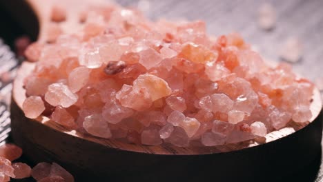 Himalayan-pink-salt-in-a-wooden-is-used-to-flavor-food.-Due-mainly-to-marketing-costs,-pink-Himalayan-salt-is-up-to-twenty-times-more-expensive-than-table-or-sea-salt.