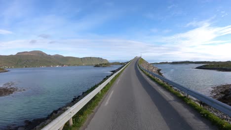 Driving-a-Car-on-a-Road-in-Norway-Lofoten.-Fredvang-Bridges-Lofoten-islands.