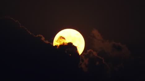 Full-moon-in-the-night-sky-among-the-clouds.