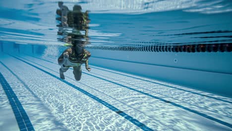 Woman-swimming-in-the-poolin-the-olympic-Swimming-pool-view-from-under-water