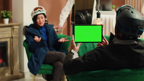 Young-man-uses-tablet-with-greenscreen