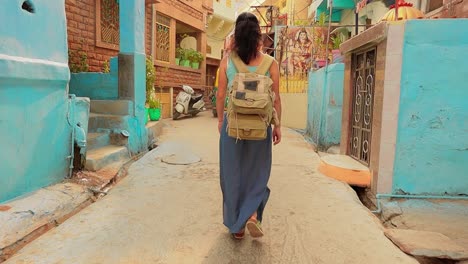 Female-tourist-walks-through-the-streets-of-an-Indian-city.-Rajasthan,-Indian-Jodhpur-Also-blue-city