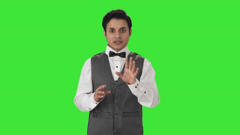 Indian-waiter-talking-to-the-camera-Green-screen
