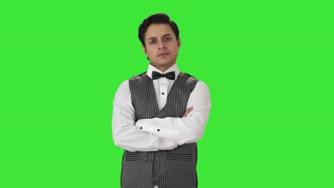 Portrait-of-confident-Indian-waiter-Green-screen