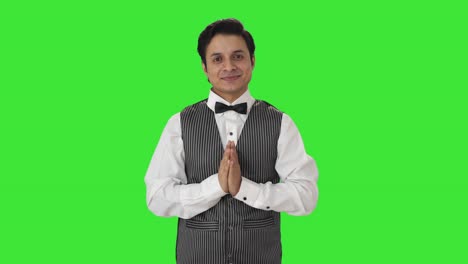 Happy-Indian-waiter-doing-Namaste-Green-screen