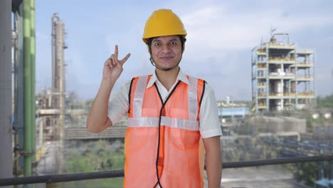 Happy-Indian-architect-showing-victory-sign