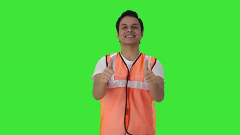 Happy-Indian-airport-ground-staff-showing-thumbs-up-Green-screen
