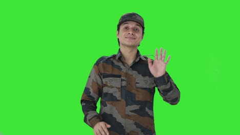 Happy-Indian-army-man-waving-hello-Green-screen