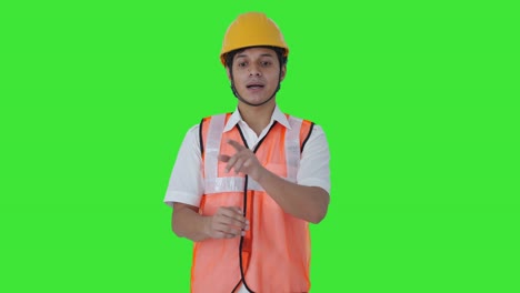 Indian-architect-talking-to-someone-Green-screen