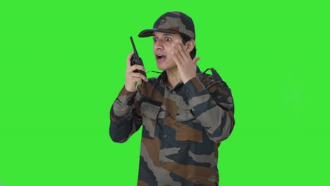 Angry-Indian-army-man-giving-instructions-on-walkie-talkie-Green-screen