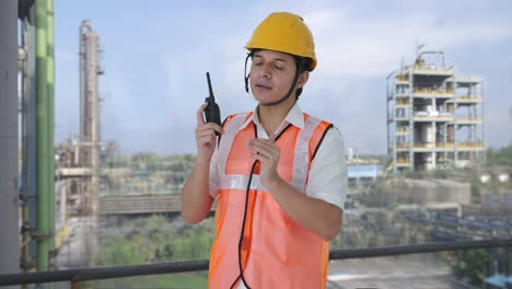 Indian-architect-giving-directions-on-walkie-talkie