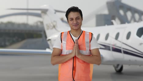 Happy-Indian-airport-ground-staff-doing-Namaste