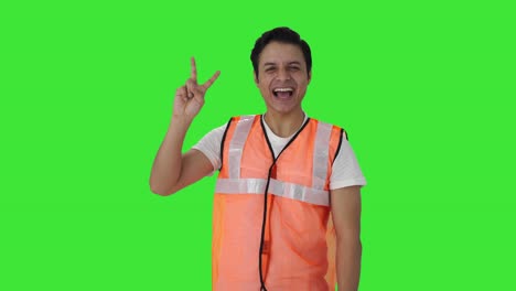 Happy-Indian-airport-ground-staff-showing-victory-sign-Green-screen
