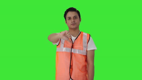 Disappointed-Indian-airport-worker-showing-thumbs-down-Green-screen